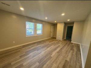 Renovated living area with new flooring and lighting at 2155 N Catherwood