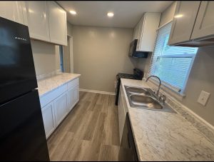 Renovated kitchen with new cabinets, countertops, and appliances at 2155 N Catherwood