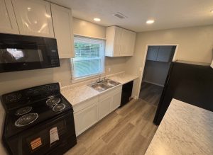 Updated kitchen with new cabinets and countertops at 2155 N Catherwood
