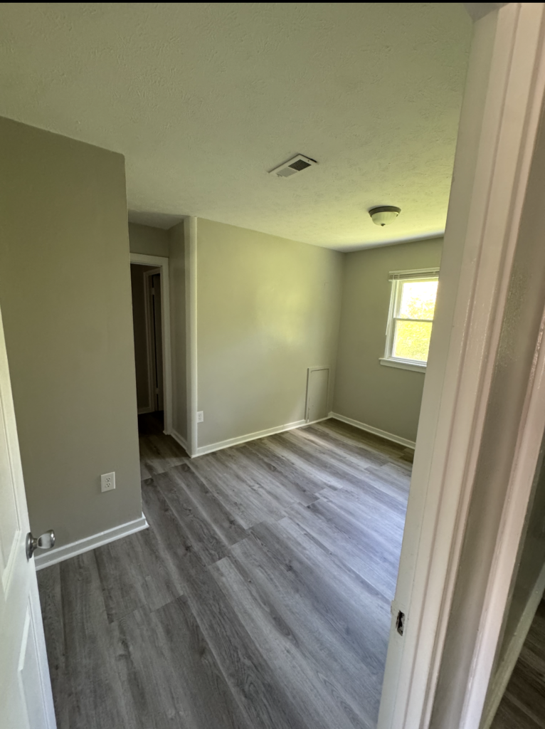 Renovated bedroom with new flooring and paint at 2155 N Catherwood