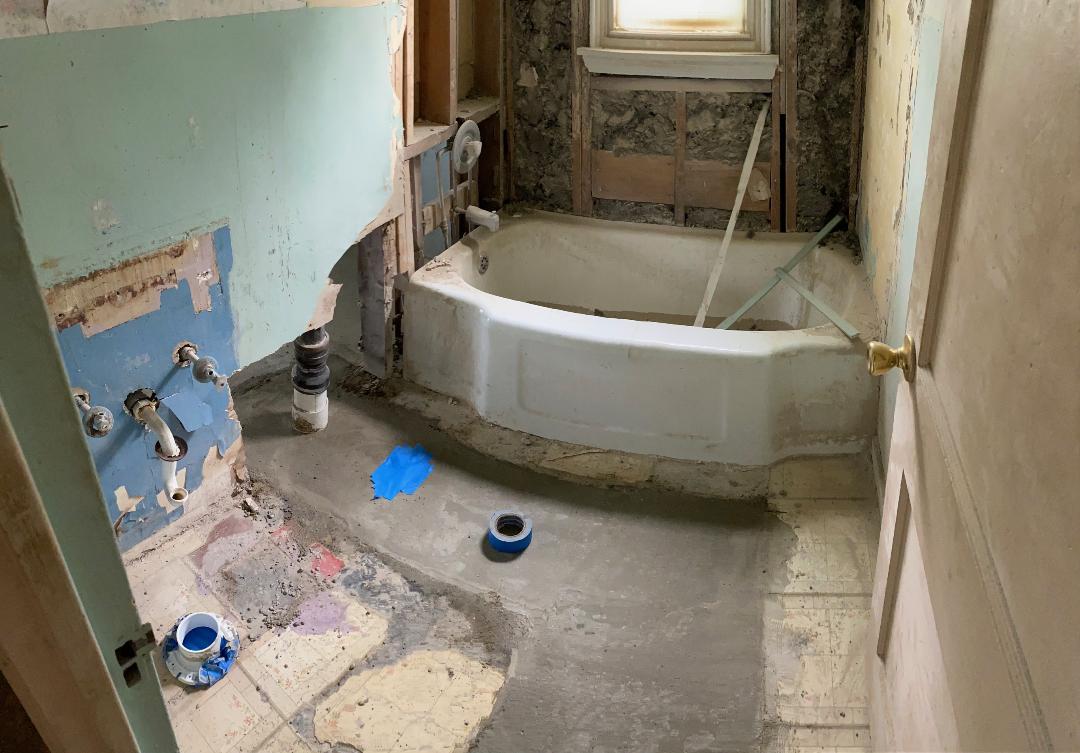 Bathroom stripped to the studs during renovation at 2155 N Catherwood
