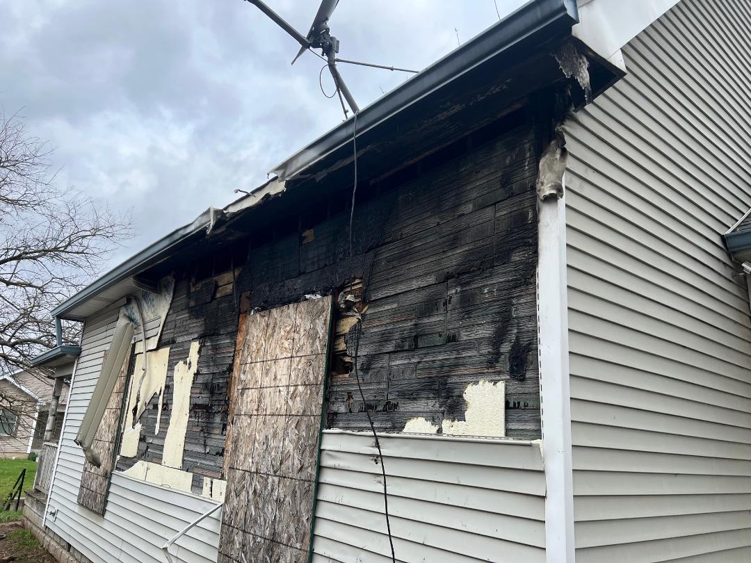 533 N Traub Ave fire damaged siding before renovation