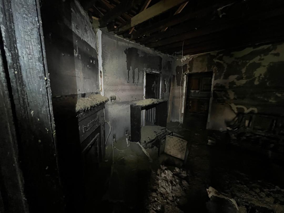 533 N Traub Ave fire damaged fireplace room before renovation
