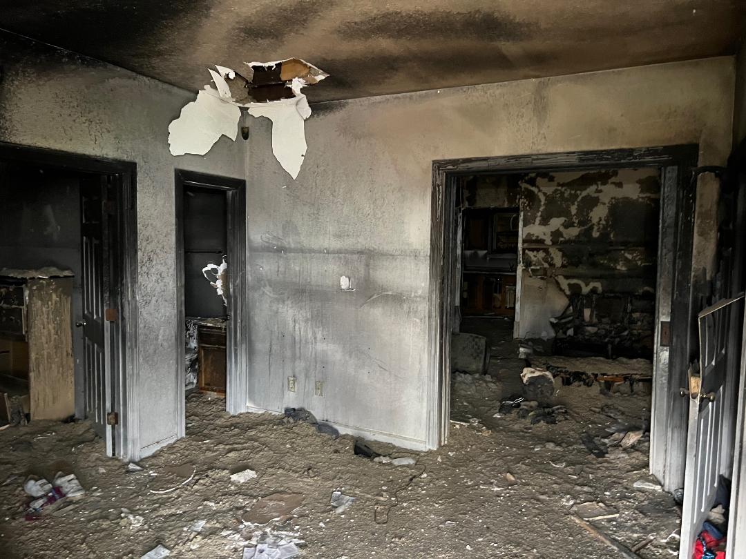 533 N Traub Ave fire damaged living room before renovation